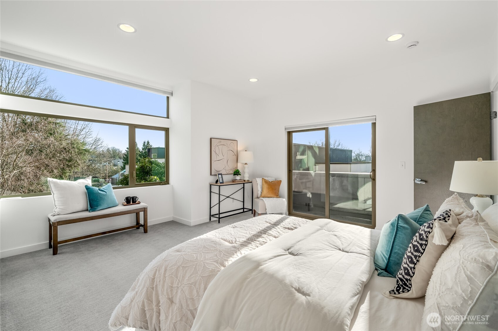 730 25th Avenue South Seattle, WA 98144 - Photo 12 of 38 a bedroom with a large bed and a large window