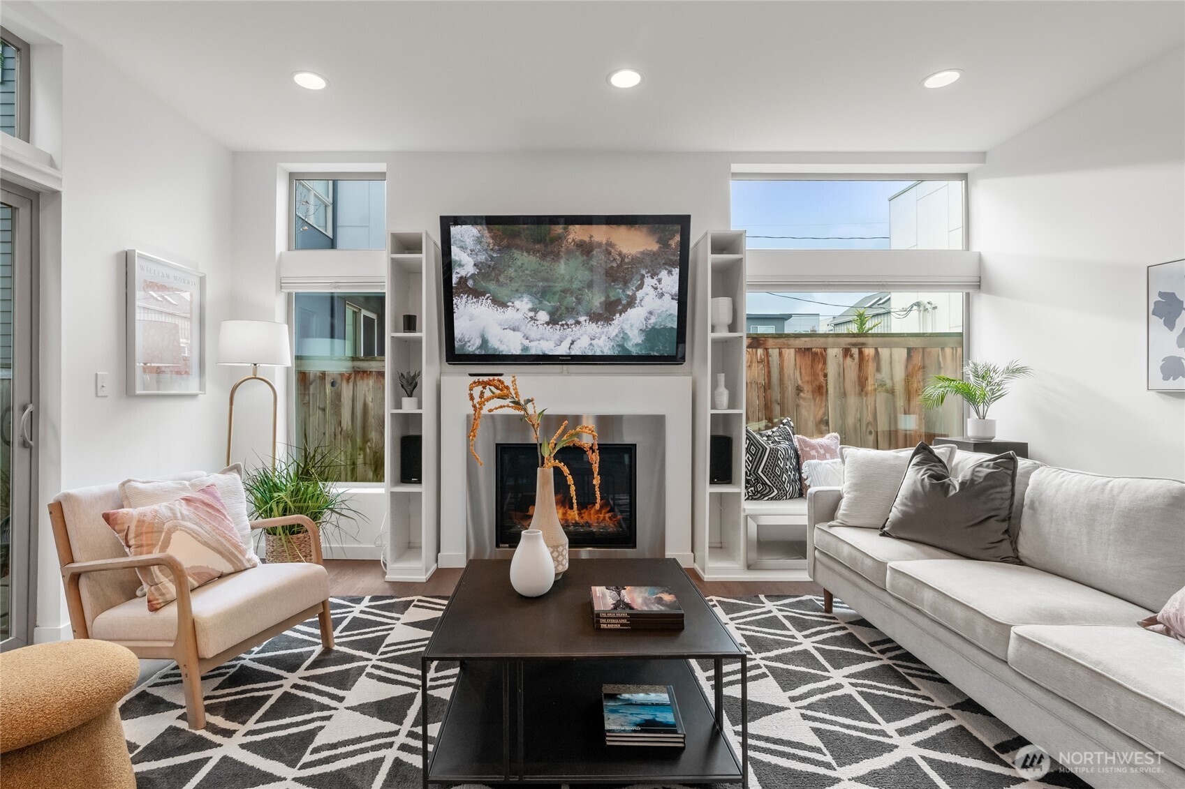 730 25th Avenue South Seattle, WA 98144 - Photo 4 of 38 a living room with furniture a fireplace and a flat screen tv