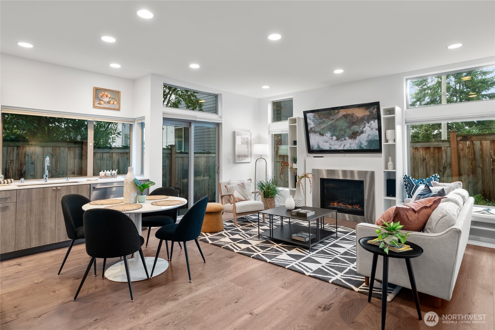 730 25th Avenue South Seattle, WA 98144 - Photo 5 of 38 a living room with furniture a fireplace and a floor to ceiling window