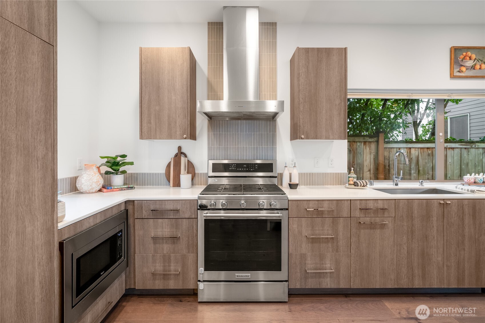 730 25th Avenue South Seattle, WA 98144 - Photo 6 of 38 a kitchen with stainless steel appliances granite countertop white cabinets and a stove