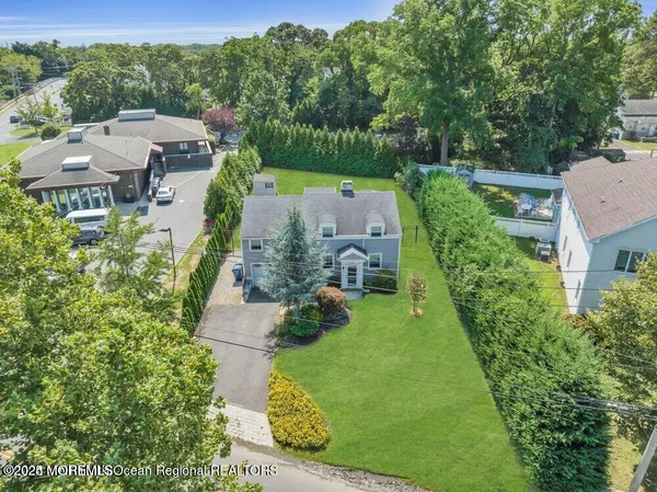 an aerial view of multiple houses with yard