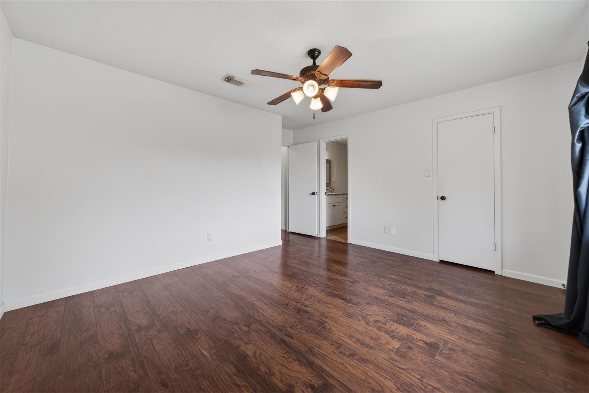 17002 Dew Drop Lane Houston, TX 77095 - Photo 23 of 24 a view of an empty room with wooden floor