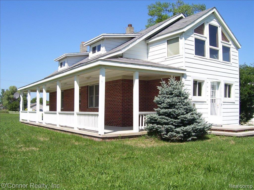 7990 Lambs Road Goodells, MI 48027 - Photo 1 of 11 7990 Lambs Road - side view