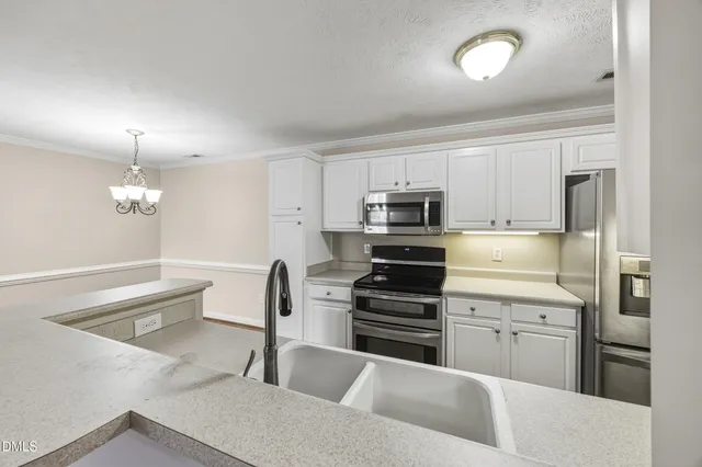 a view of a hallway with wooden floor and closet