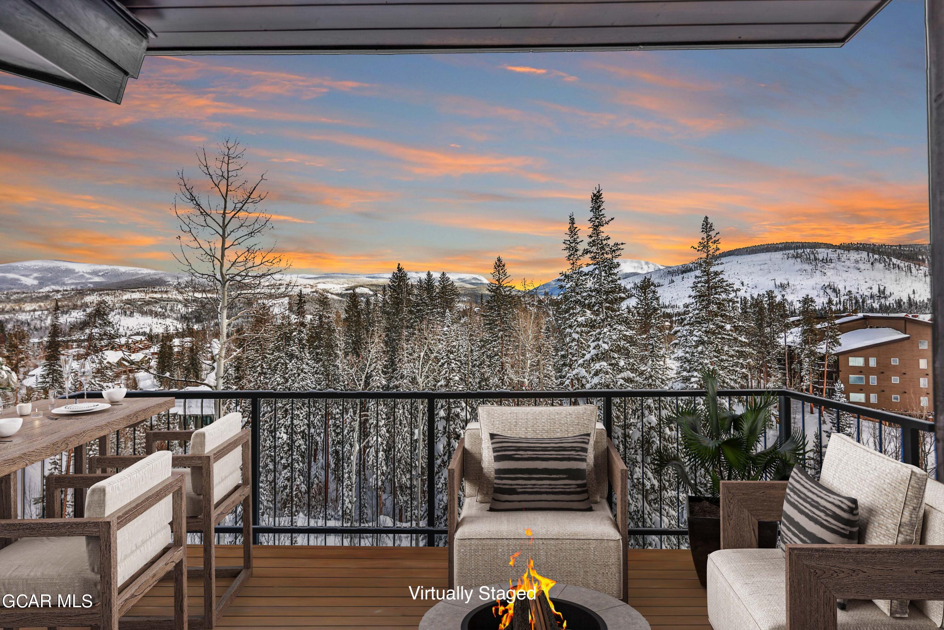 381 Bear Trail Winter Park, CO 80482 - Photo 12 of 38 a view of a balcony with two chairs and a potted plant