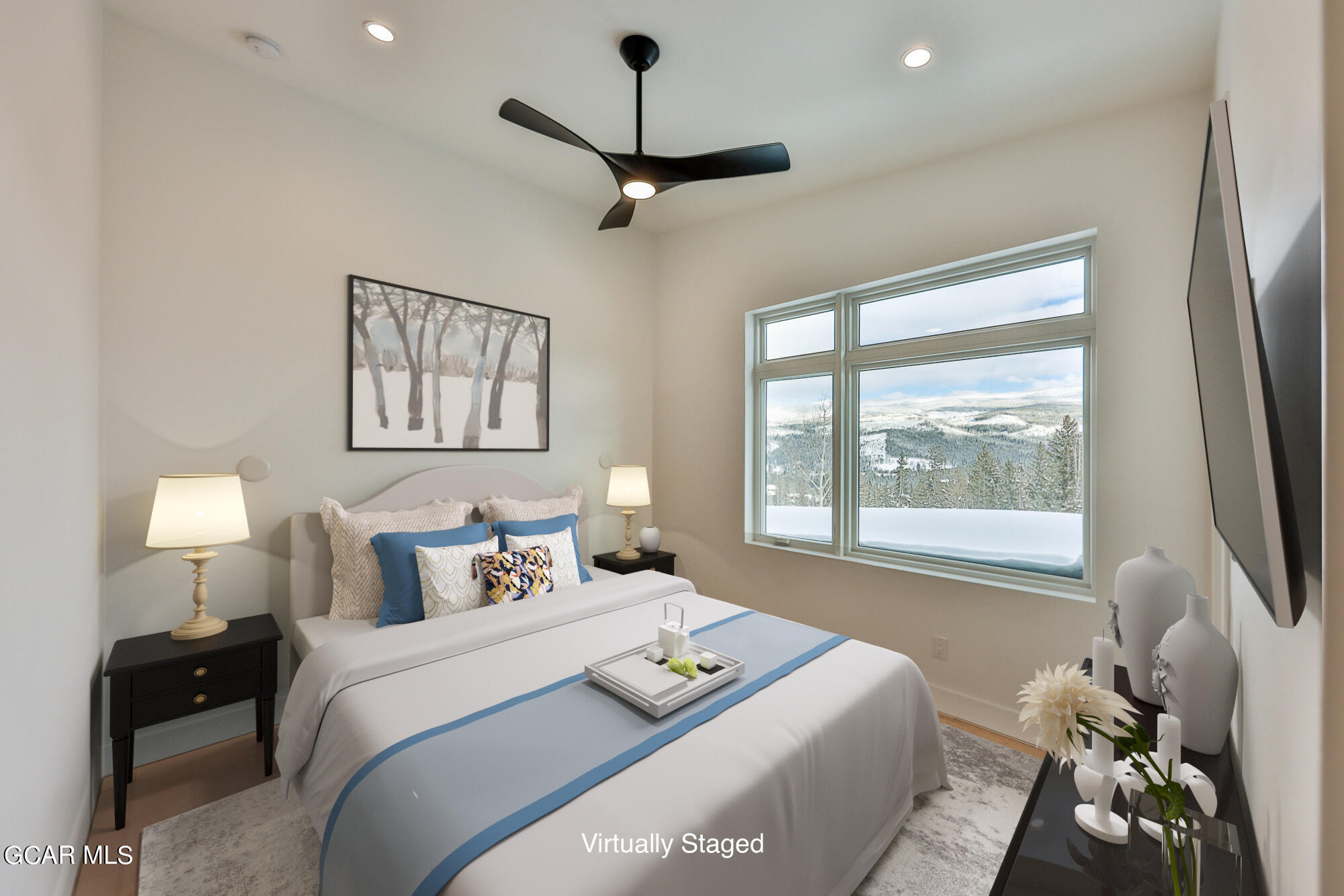 381 Bear Trail Winter Park, CO 80482 - Photo 14 of 38 a bedroom with a bed a window and a flat screen tv