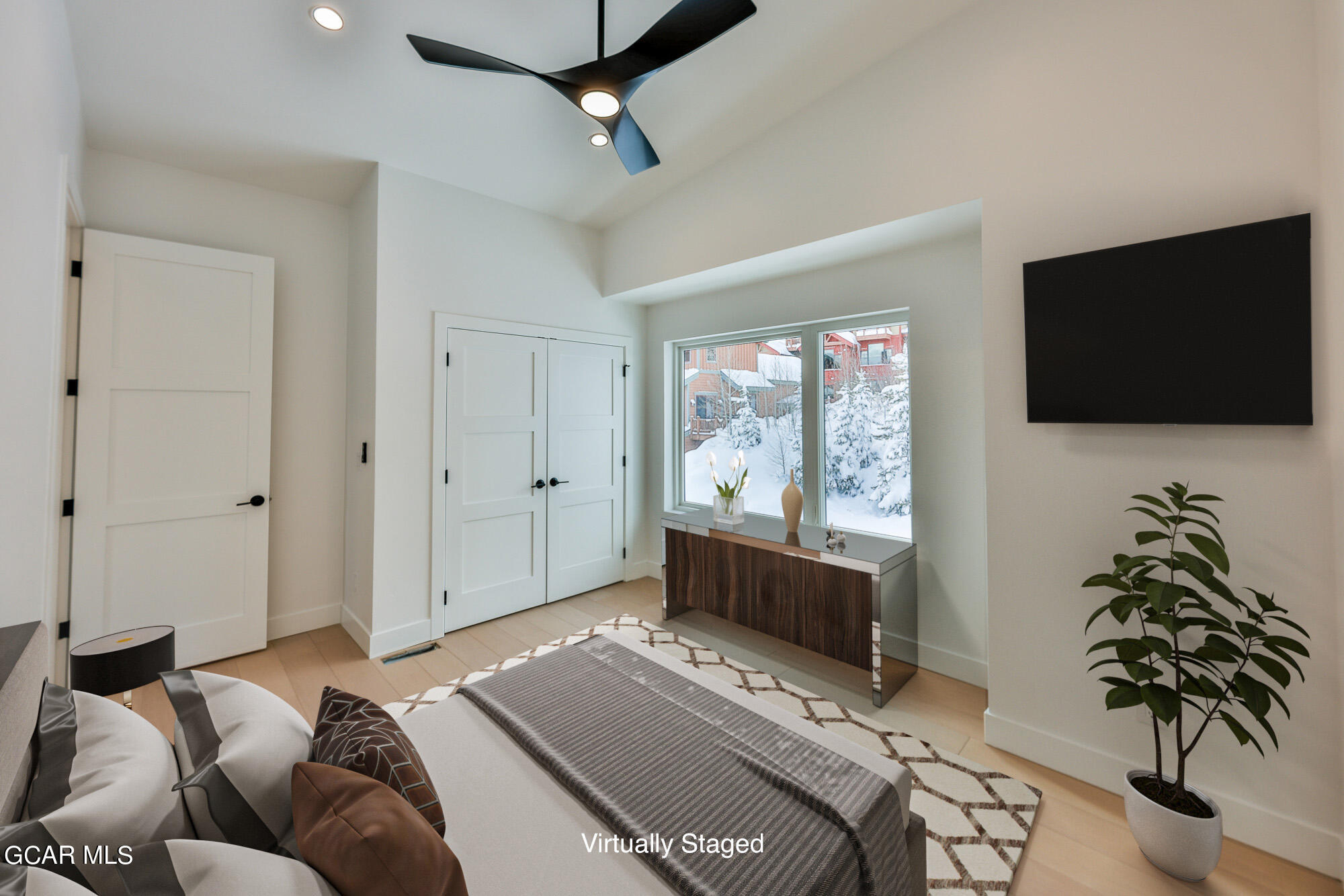 381 Bear Trail Winter Park, CO 80482 - Photo 16 of 38 a living room with furniture a window and a flat screen tv