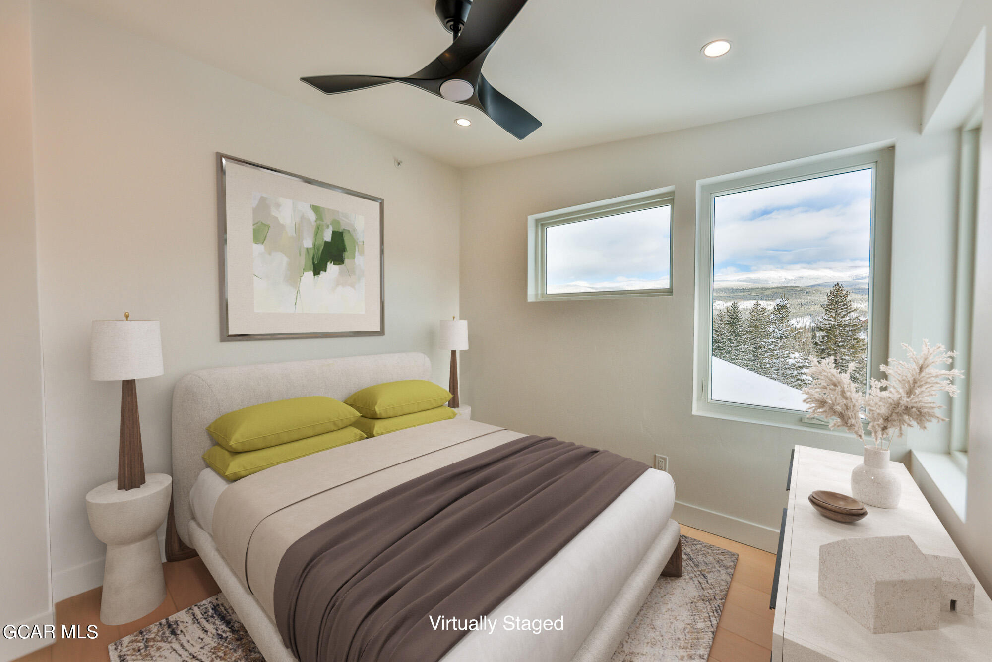 381 Bear Trail Winter Park, CO 80482 - Photo 17 of 38 a bedroom with a bed and a painting on the wall