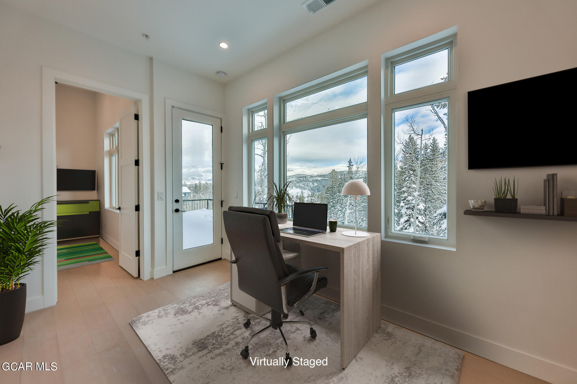 381 Bear Trail Winter Park, CO 80482 - Photo 19 of 38 a view of a workspace with furniture and a window