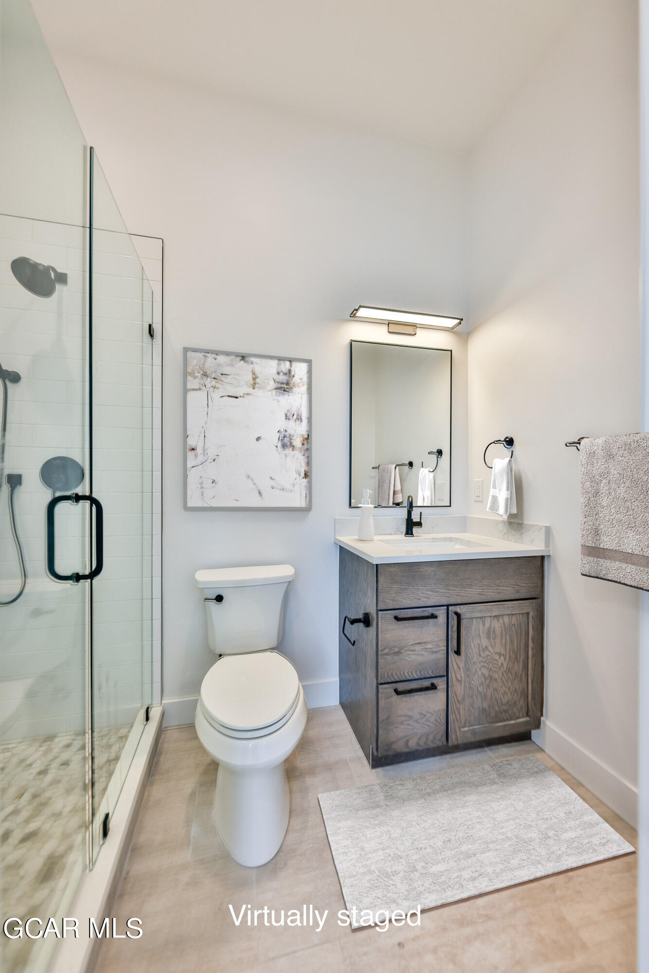 381 Bear Trail Winter Park, CO 80482 - Photo 21 of 38 a bathroom with a toilet sink and mirror