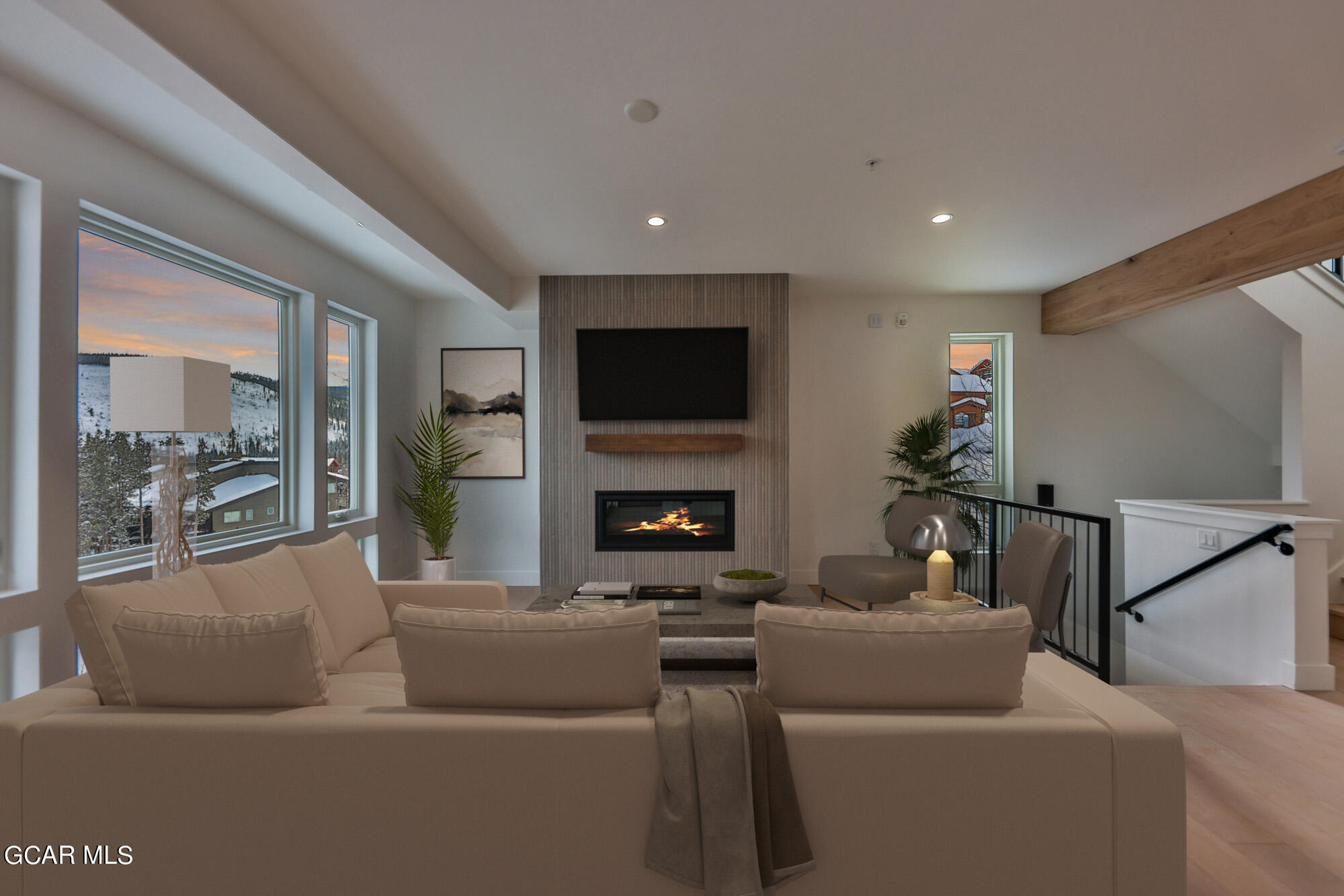 381 Bear Trail Winter Park, CO 80482 - Photo 3 of 38 a living room with furniture and a flat screen tv