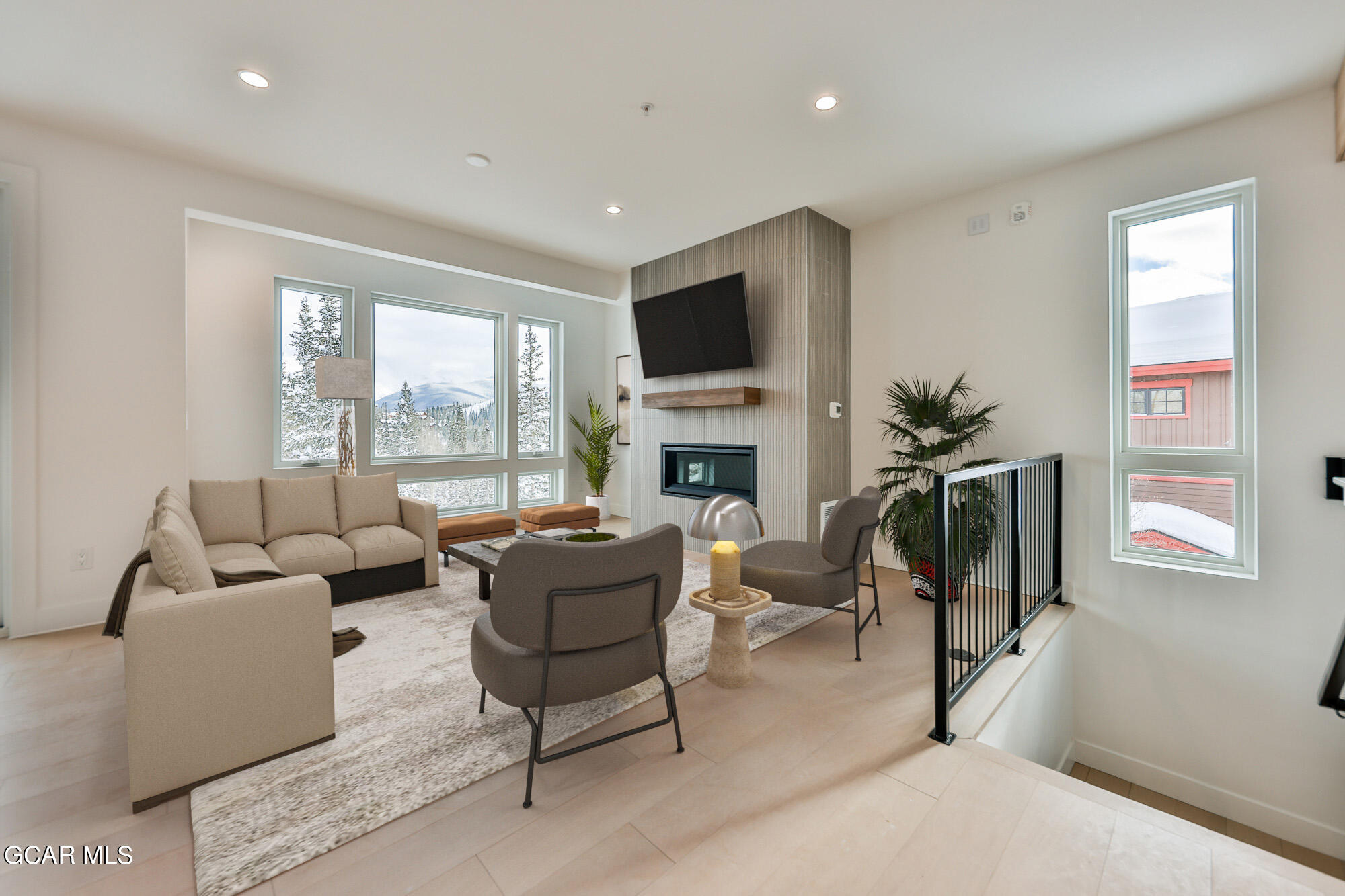 381 Bear Trail Winter Park, CO 80482 - Photo 6 of 38 a living room with fireplace furniture and a flat screen tv