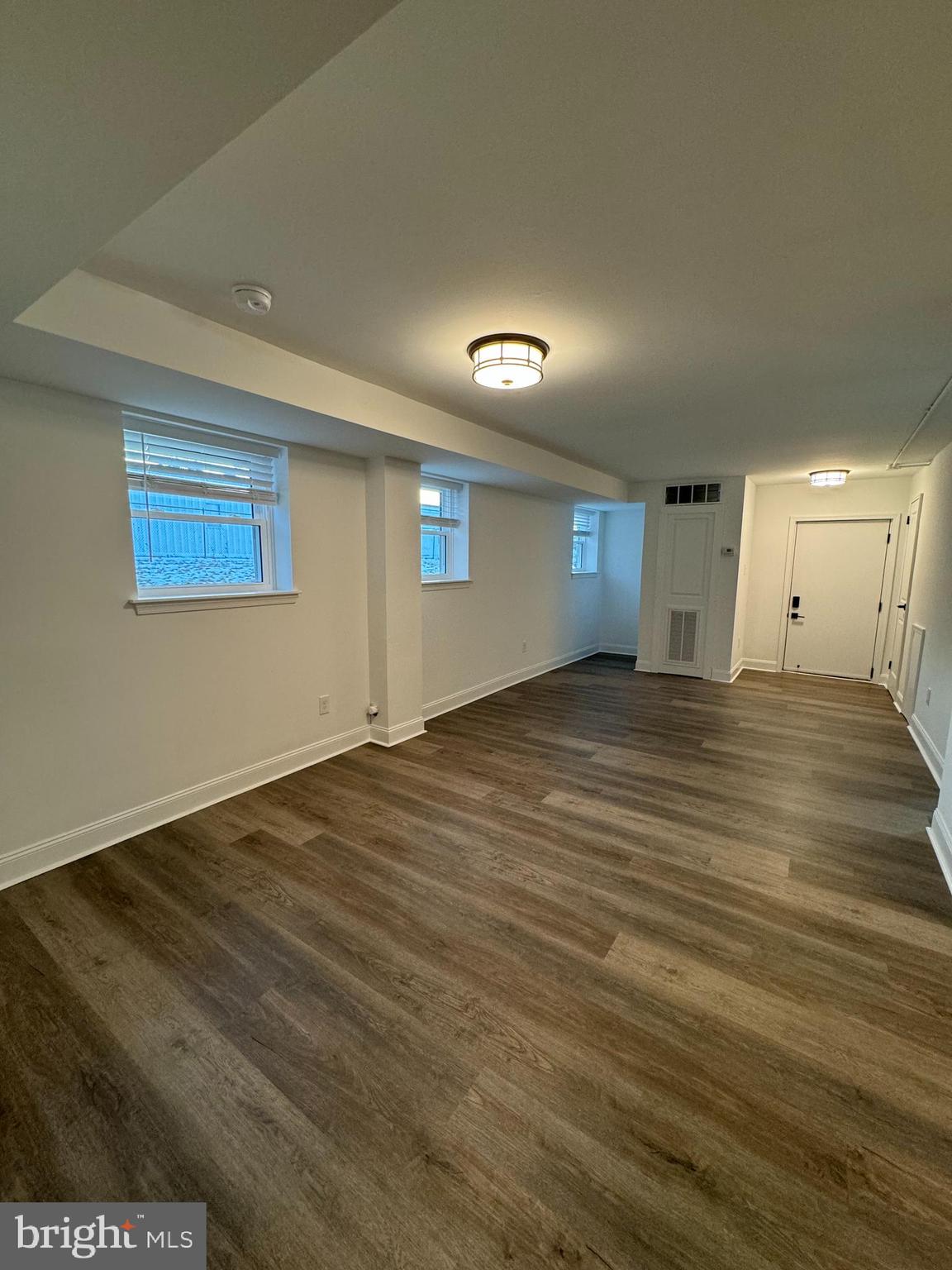 1841 Davisville Road, Unit G4 Willow Grove, PA 19090 - Photo 2 of 12 a view of an empty room with wooden floor