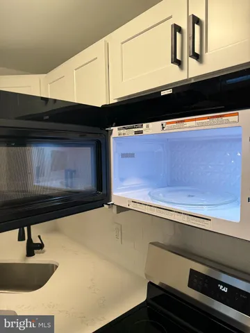 a close view of sink and microwave