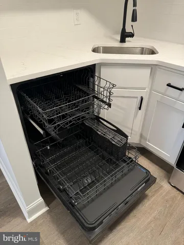 a stove top oven sitting inside of a kitchen