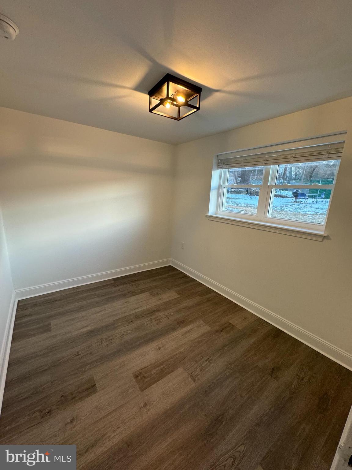 1841 Davisville Road, Unit G4 Willow Grove, PA 19090 - Photo 10 of 12 an empty room with wooden floor fan and windows