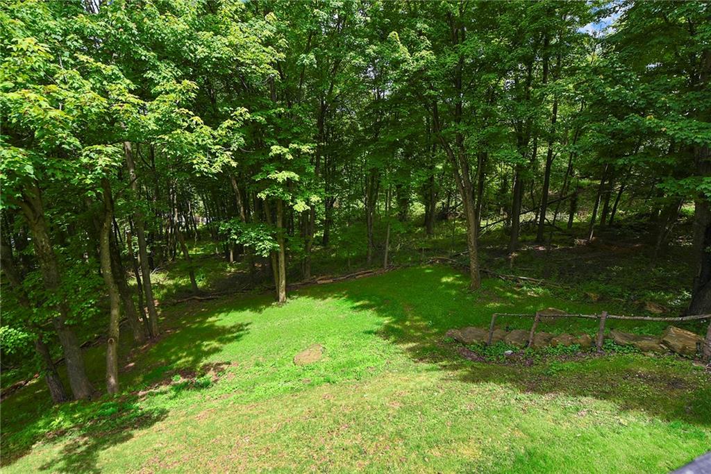 7018 Franklin Road Seven Fields, PA 16046 - Photo 48 of 48 a backyard of a house with lots of green space