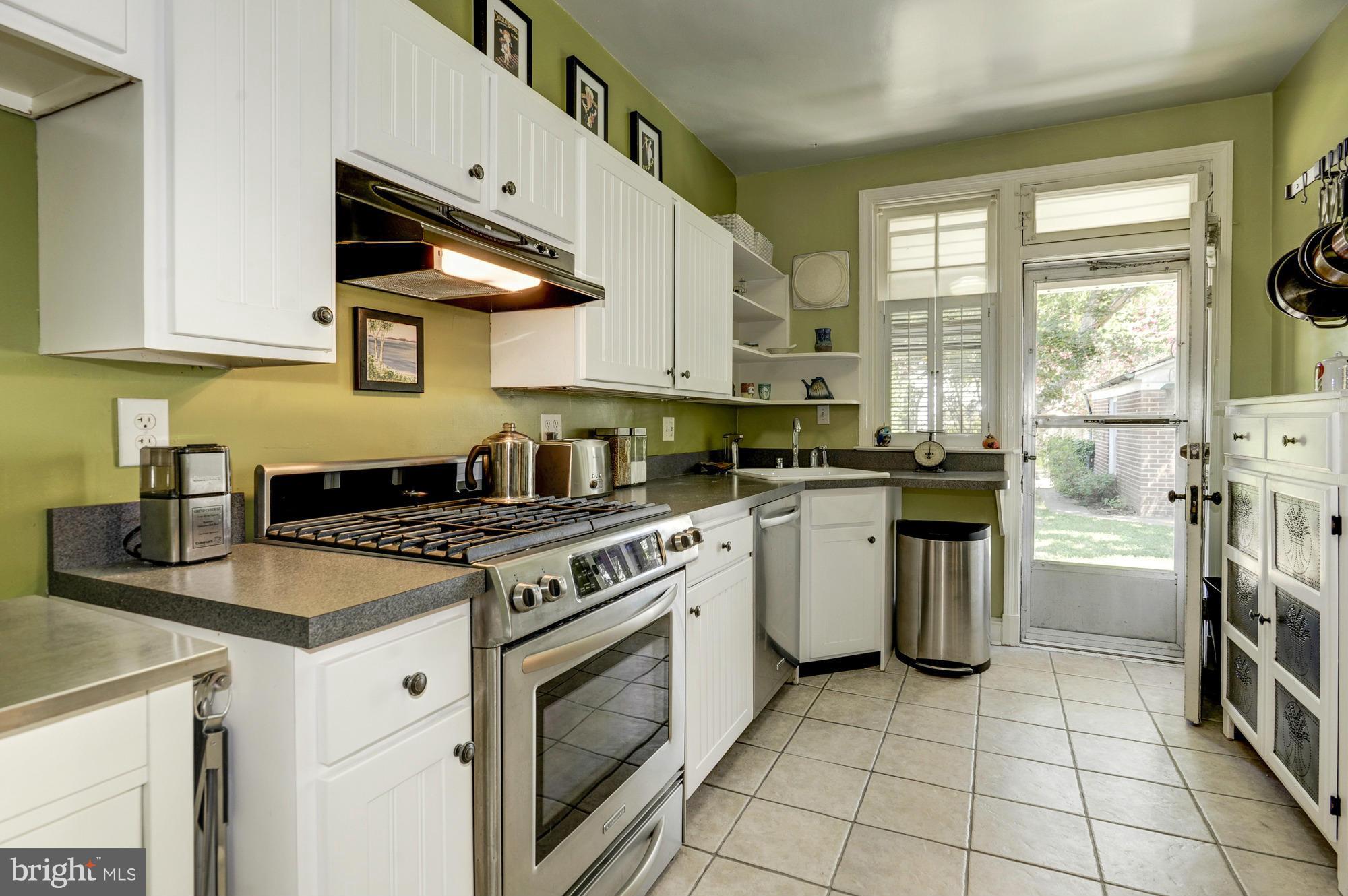 410 Hopkins Road Baltimore, MD 21212 - Photo 11 of 30 a kitchen with a stove a sink and a microwave