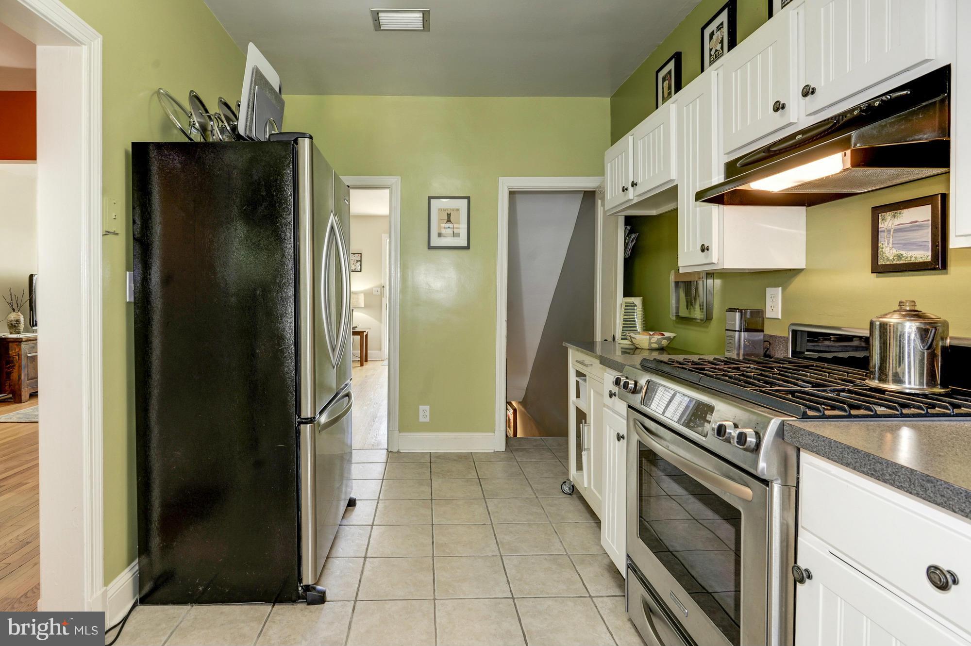 410 Hopkins Road Baltimore, MD 21212 - Photo 12 of 30 a kitchen with stainless steel appliances granite countertop a refrigerator and a stove