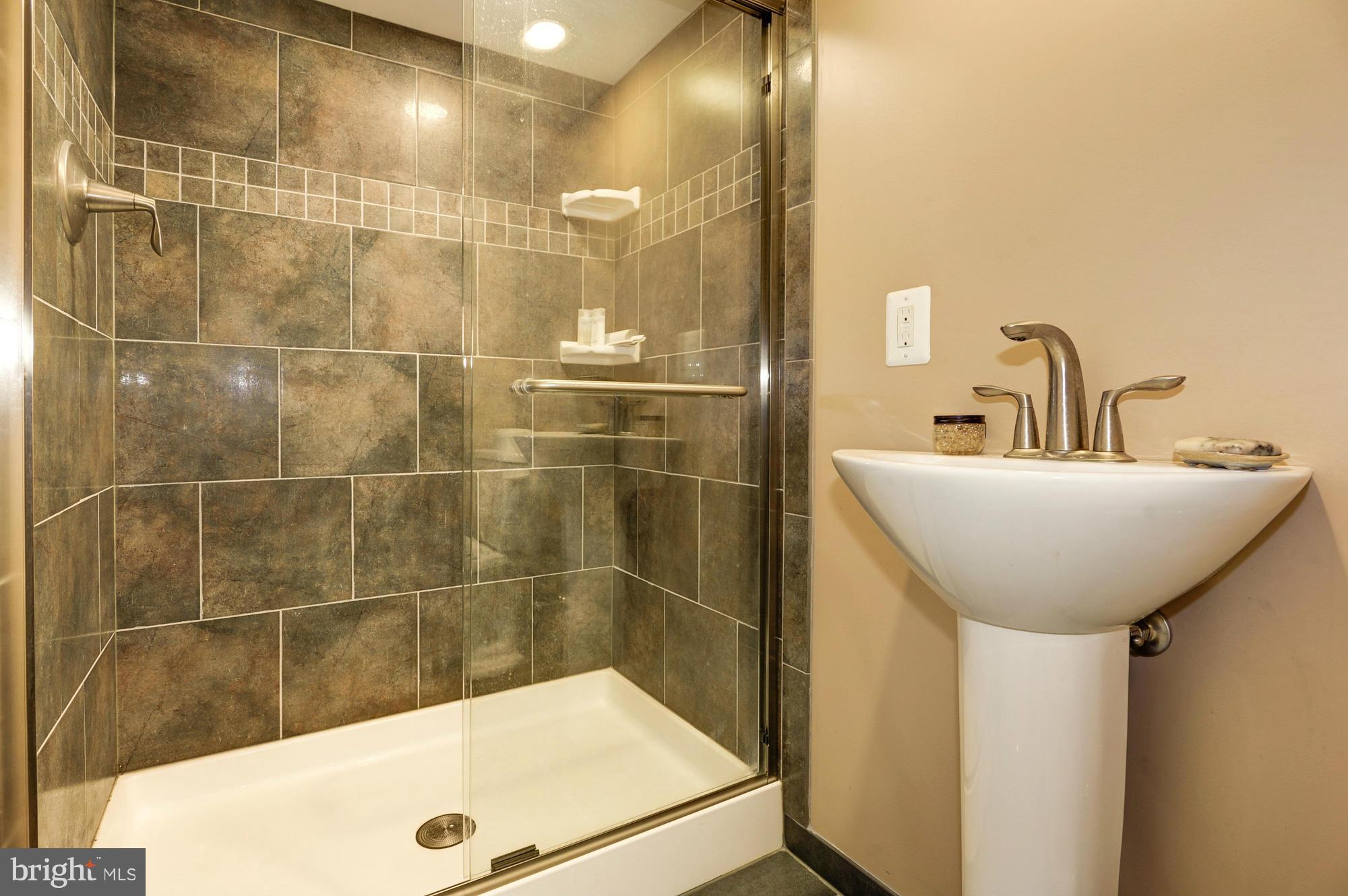 410 Hopkins Road Baltimore, MD 21212 - Photo 16 of 30 a bathroom with a sink and a mirror