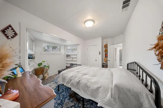 a bedroom with a bed and a couch