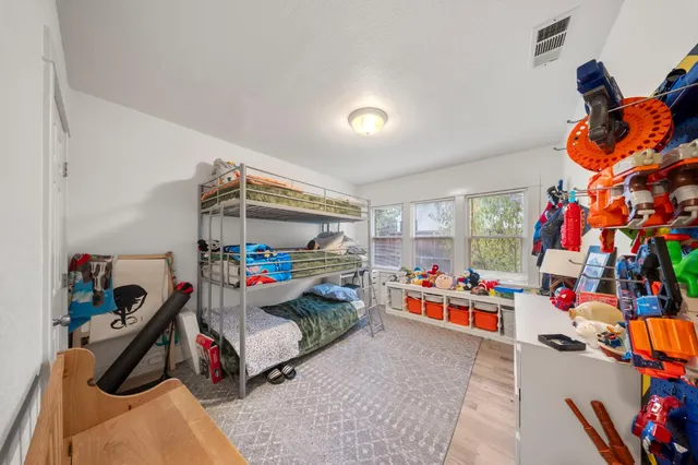 a children room with toys and a flat screen tv