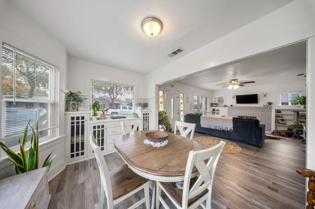 a view of a dining room with furniture window and wooden floor