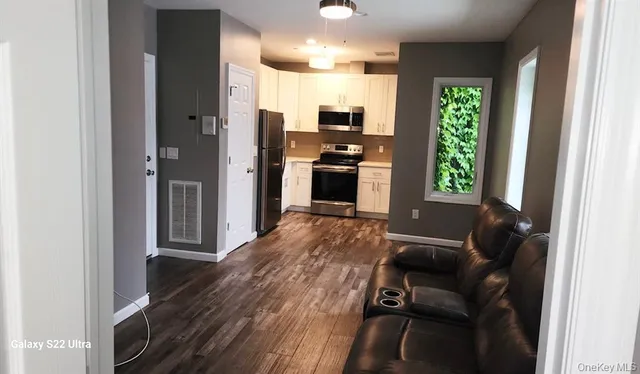 a view of a living room and dining room
