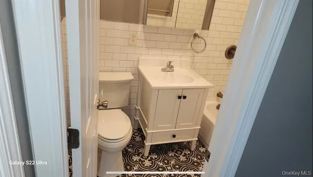 a bathroom with a sink and a toilet