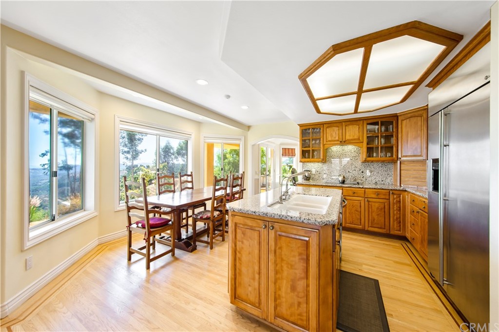 46250 Camaron Road Temecula, CA 92590 - Photo 19 of 46 a view of a dining room with furniture a chandelier and wooden floor