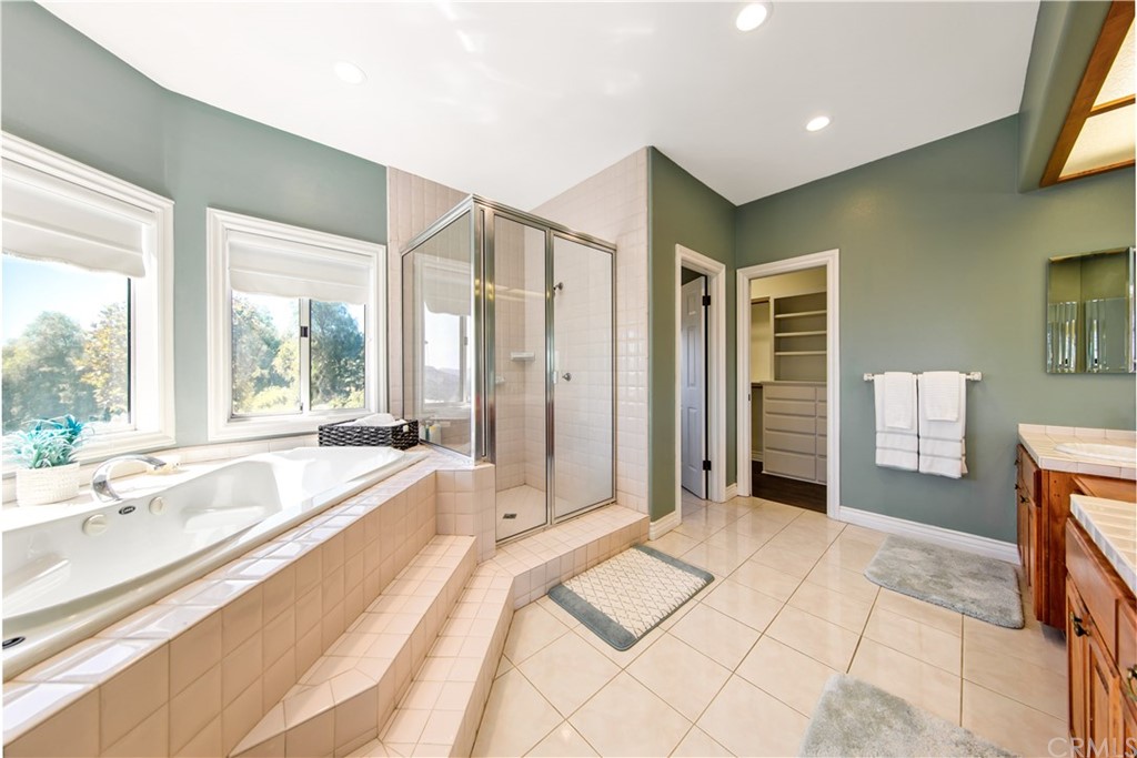 46250 Camaron Road Temecula, CA 92590 - Photo 38 of 46 a spacious bathroom with a tub sink and large windows
