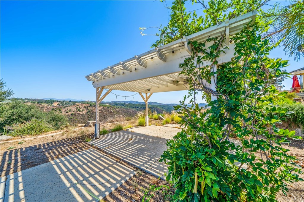 46250 Camaron Road Temecula, CA 92590 - Photo 10 of 46 a view of a balcony with floor to ceiling windows with wooden floor