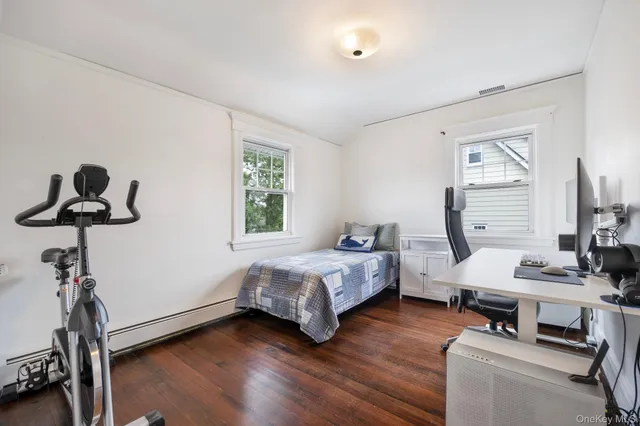 a bedroom with bed and a window