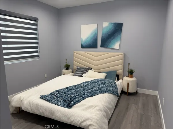 a bedroom with a bed and window