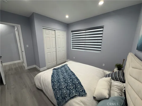 a living room with a bed furniture and a window