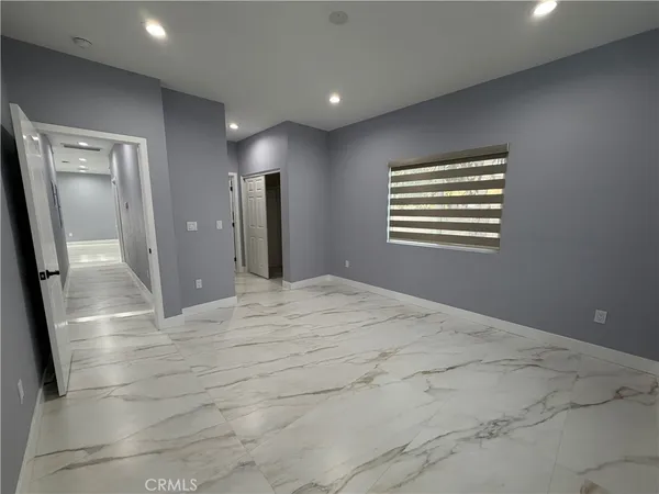 a view of a hallway with windows