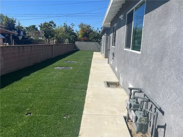 a view of a backyard with potted plants
