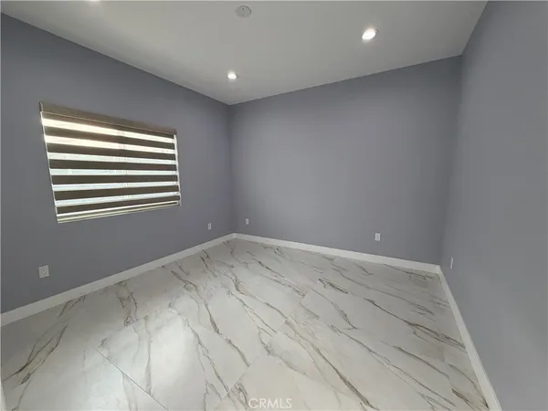 a view of empty room with windows