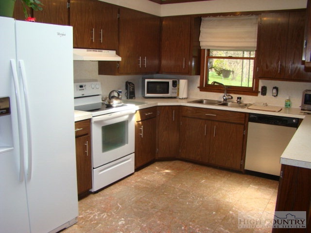 3262 Bamboo Road Boone, NC 28607 - Photo 9 of 12 a kitchen with a sink stove and refrigerator