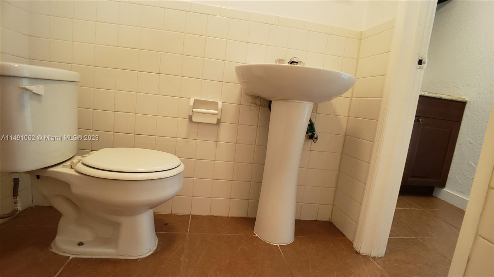 Miami-Dade County Miami, FL 33161 - Photo 25 of 31 a bathroom with a sink toilet and shower