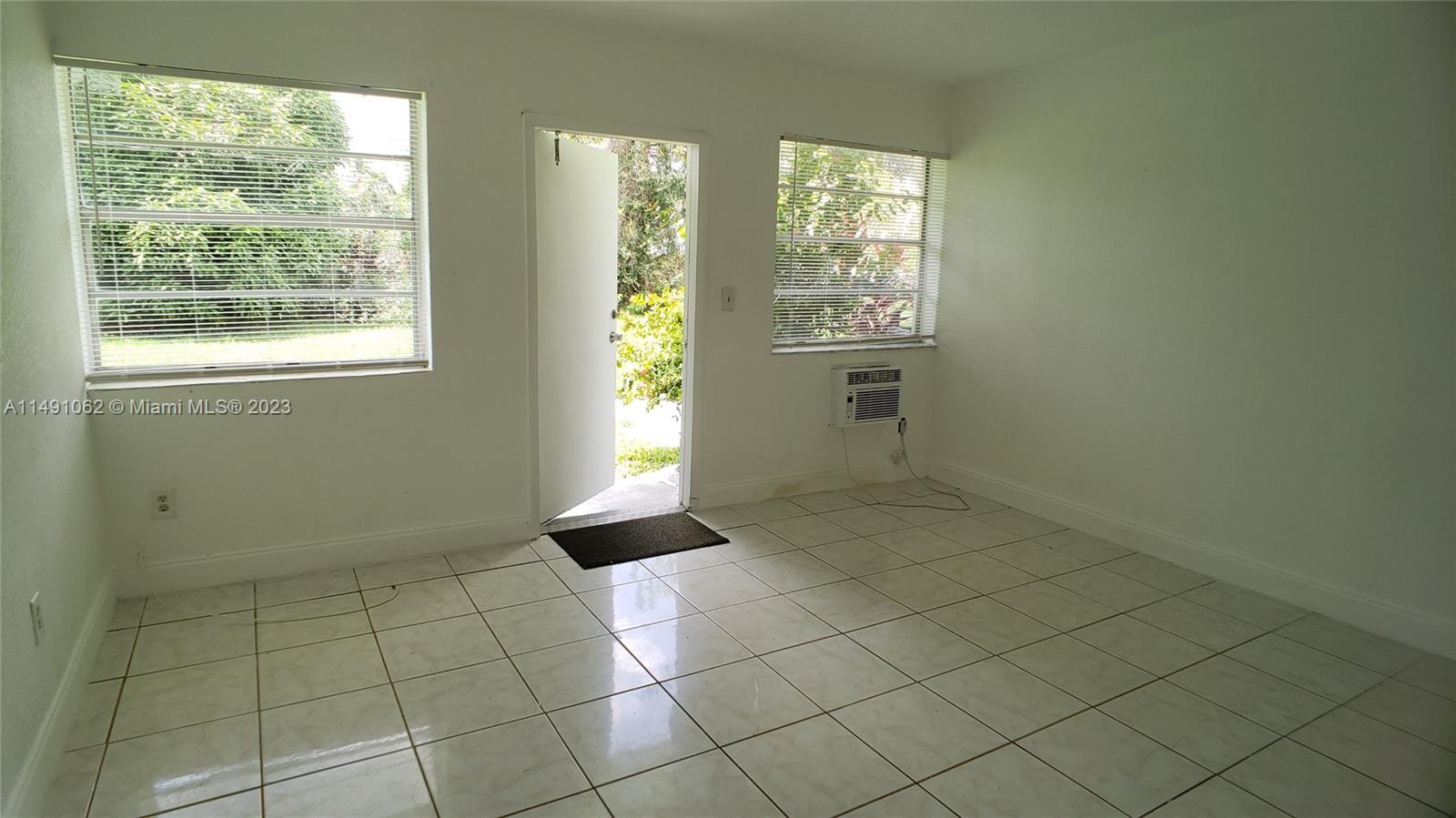 Miami-Dade County Miami, FL 33161 - Photo 26 of 31 a view of an empty room and window