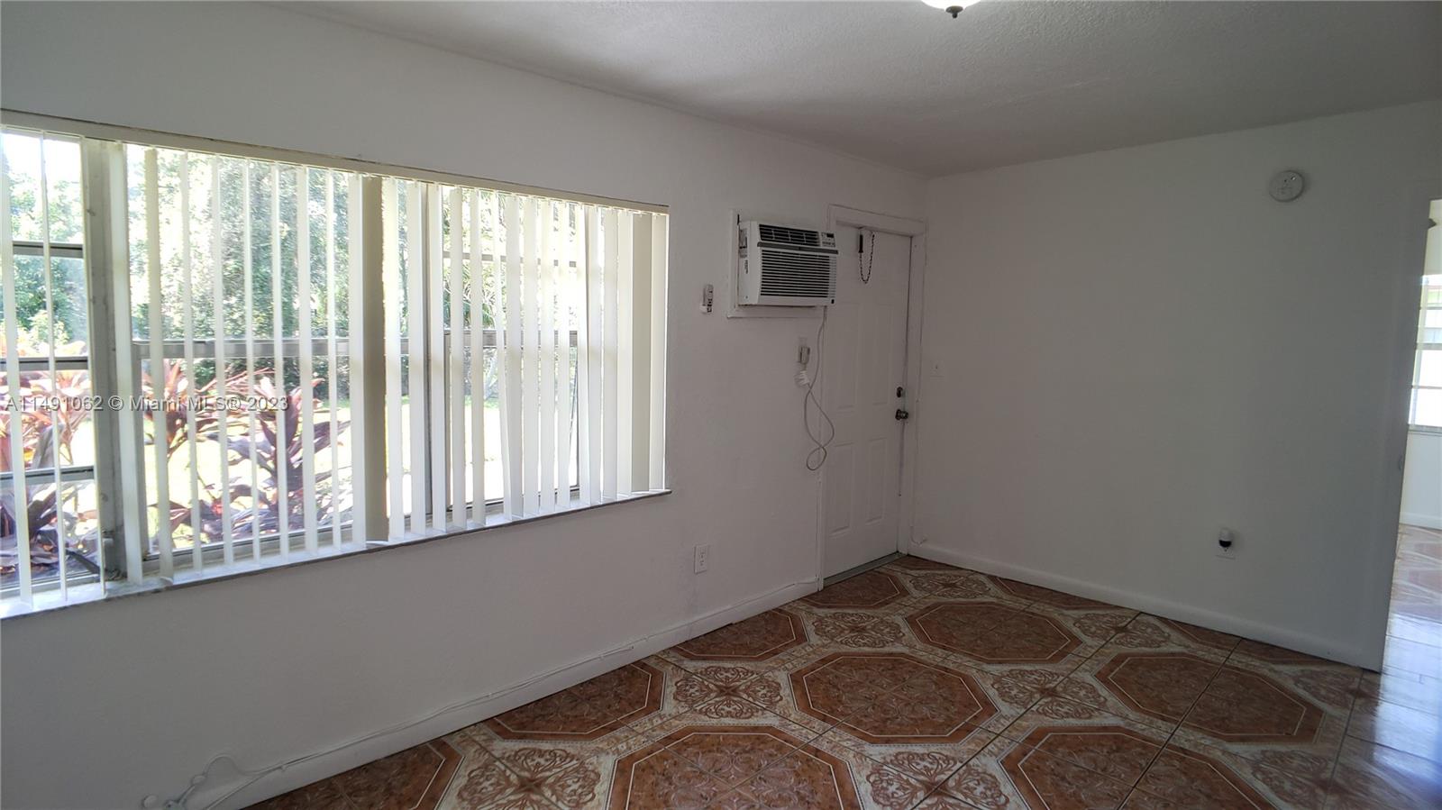 Miami-Dade County Miami, FL 33161 - Photo 29 of 31 a view of an empty room with a window