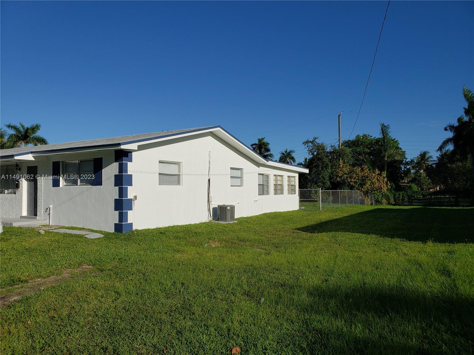 Miami-Dade County Miami, FL 33161 - Photo 3 of 31 a view of a house with backyard and garden