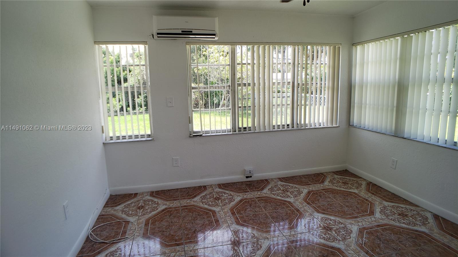 Miami-Dade County Miami, FL 33161 - Photo 8 of 31 a bedroom with a bed and a window