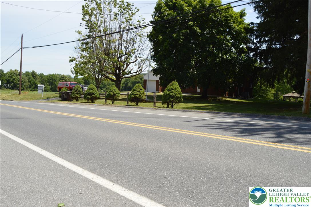 1819 Blue Barn Road Orefield, PA 18069 - Photo 2 of 21 Mature trees and neat shrubbery adorn this charming property alongside a quiet road.