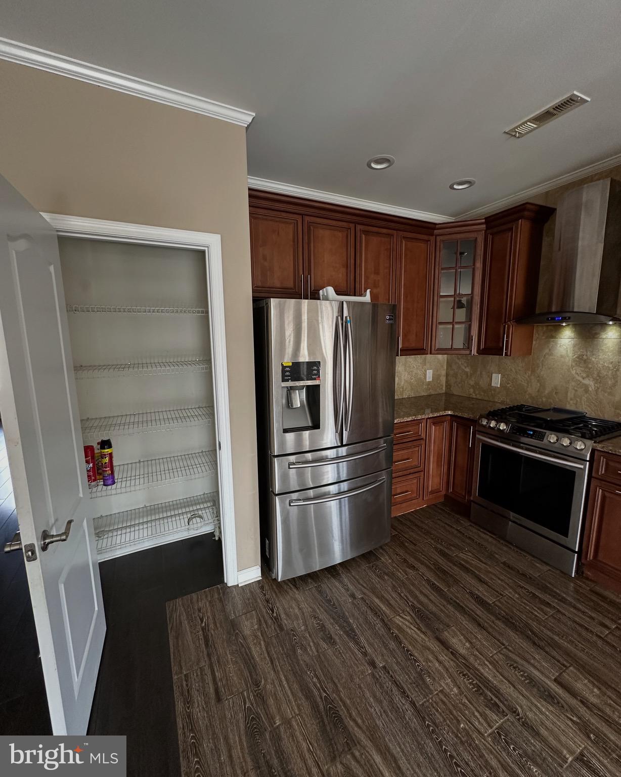 290 Byberry Road, Unit 2 Philadelphia, PA 19116 - Photo 2 of 12 a kitchen with stainless steel appliances a refrigerator and a stove top oven