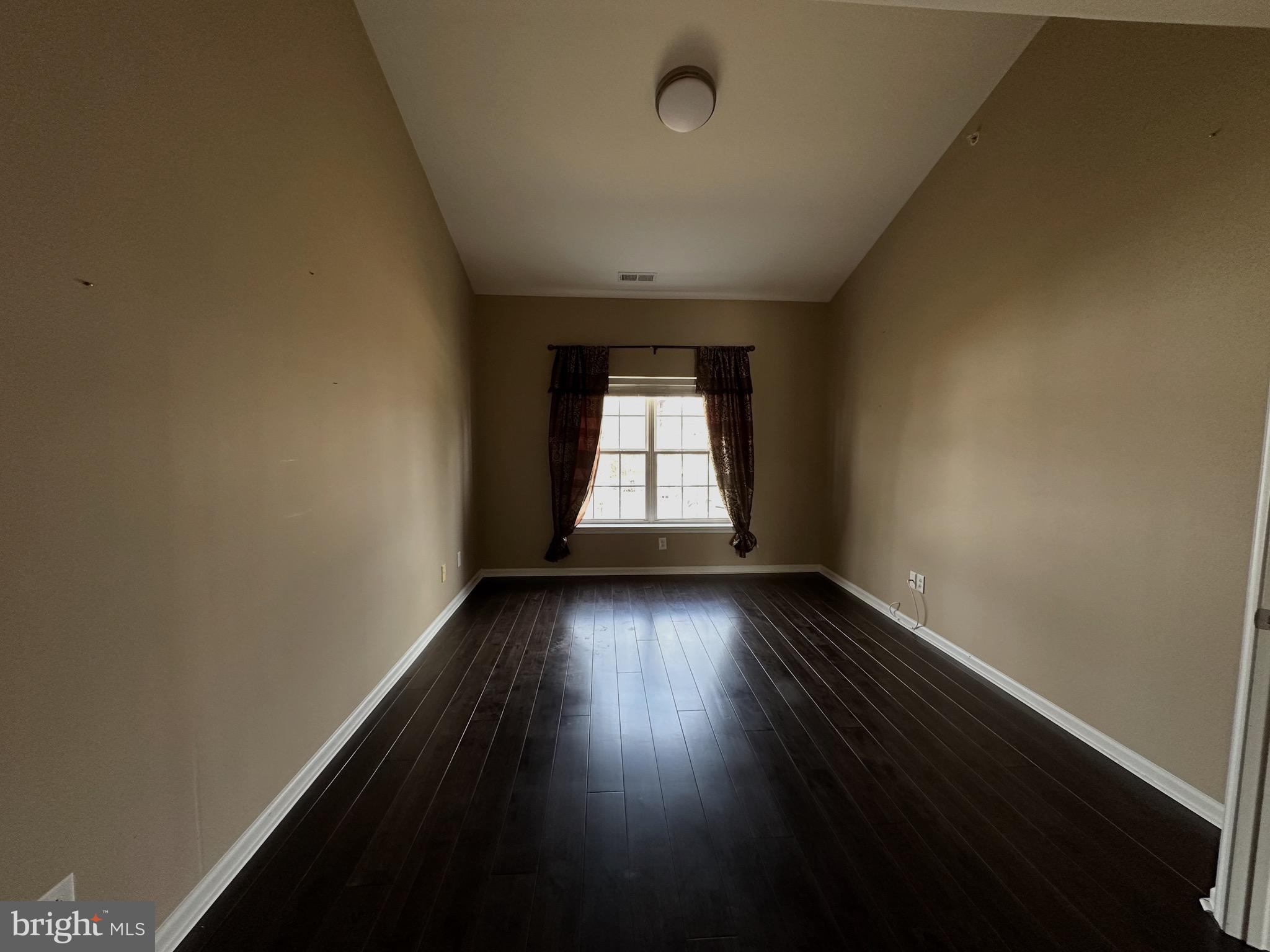 290 Byberry Road, Unit 2 Philadelphia, PA 19116 - Photo 6 of 12 an empty room with wooden floor and windows