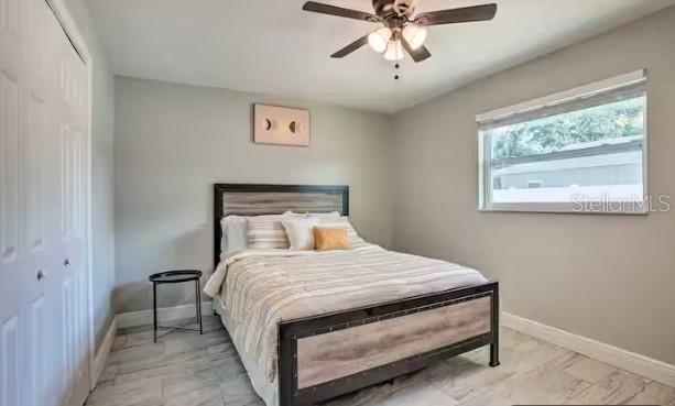 2 Booth Boulevard Safety Harbor, FL 34695 - Photo 5 of 9 a bedroom with a bed and window