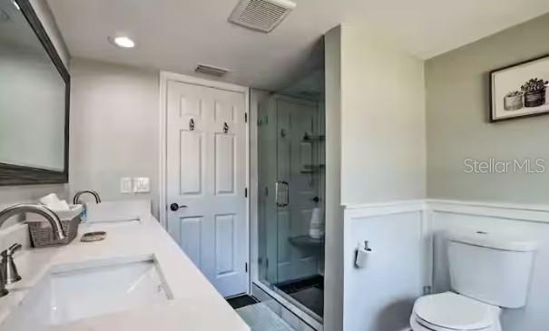 2 Booth Boulevard Safety Harbor, FL 34695 - Photo 7 of 9 a bathroom with a sink a toilet and shower