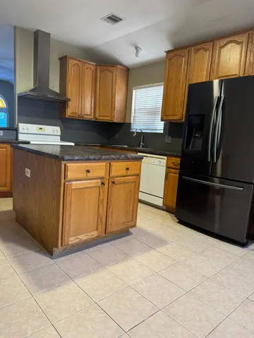 a kitchen with a cabinets and window